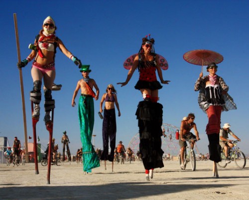 Burning Man Festival - stilts - images from Reno Airport Exhibit