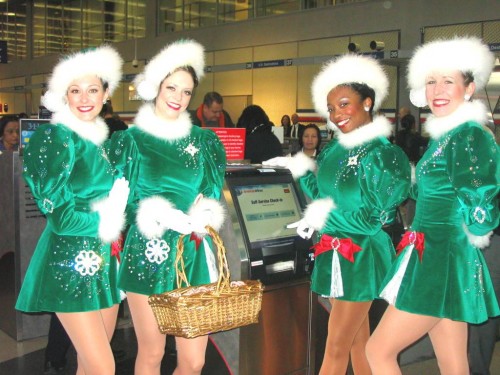 Rockettes in green holiday outfits