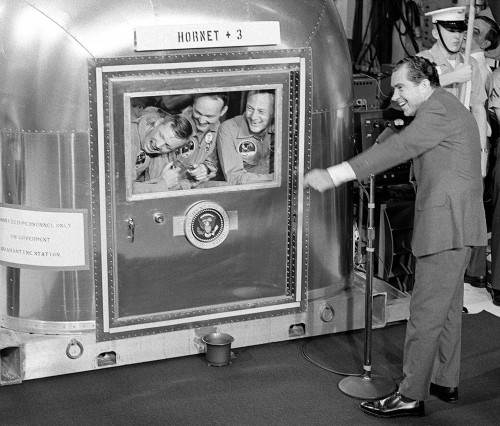 President Richard Nixon telling jokes to astronauts Neil Armstrong, Michael Collins, and Buzz Aldrin