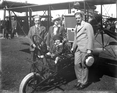 SFO_Art Smith ( left) with his biplane and fairgoers at the Panama-Pacific International Exposition,