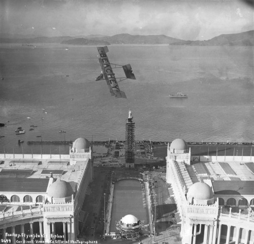 SFO_Lincoln Beachey performing in his biplane over the Panama-Pacific International Exposition grounds,