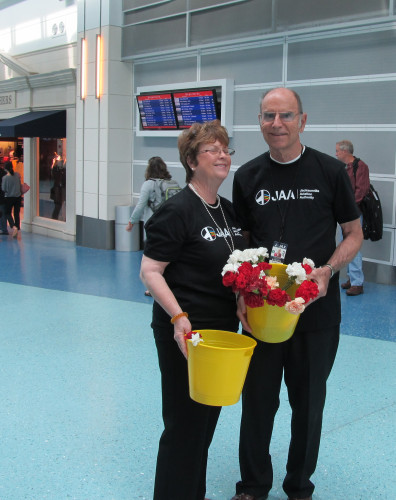 Volunteer amabassadors at Jacksonville Int'l Airport will hand out 1,000 carnations_edited