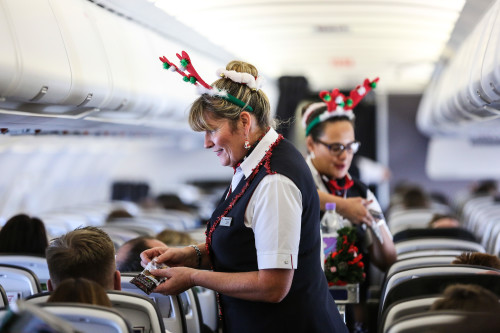 LAPLAND, FINLAND: Andrea Hatfield (Cabin Crew) gets into the Christmas spirit onboard a special charter to Lapland from London Gatwick on 07 December 2015