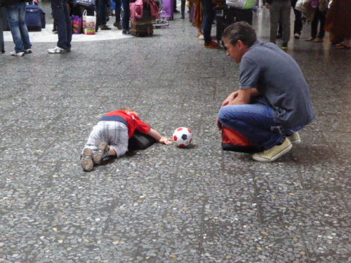 Kids with soccer ball at Zurich Airport