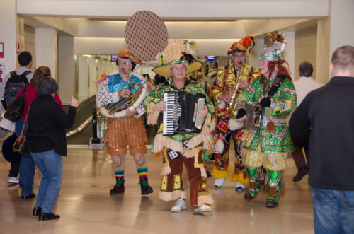 The Philadelphia Mummers entertain airport visitors during the holiday season at Philadelphia International Airport.