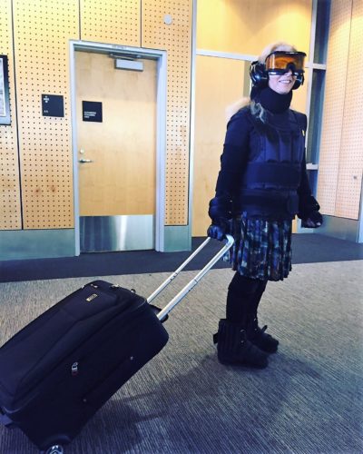 Harriet Baskas wearing 30 pounds of 'aging suit' apparatus for test walk through SEA airport