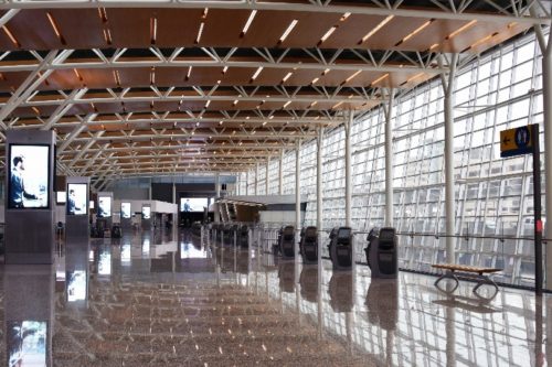 new-international-terminal-check-in-hall-has-vaulted-ceilings-using-douglas-fir-reminiscent-of-albertas-forested-landscape