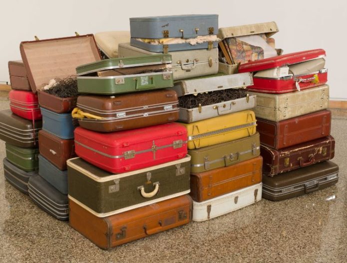 Exhibit uses suitcases to explore 'baggage' Stuck at the Airport