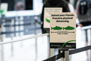 FlyHealthy@SEA Signs and graphics at the airport highlighting the Ports committment to the healthy and safety of passengers during the COVID-19 pandemic.