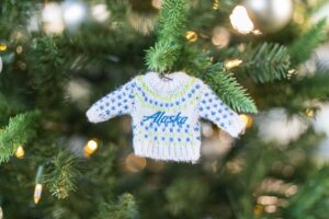 See Alaska Airlines’ new safety dance & buy the airline’s holiday sweater for a good cause