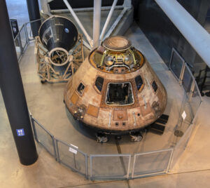 Mercury MR-3, "Freedom 7", (A19620021000) and Apollo 11 Command Module, "Columbia", (A19700102000) on display in the front of the James S McDonnell Space Hangar at the Steven F Udvar-Hazy Center in Chantilly, VA. April 23, 2021. (Smithsonian Photo by Mark Avino)