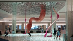 At airports: a giant flamingo, doodles, & Disney salute
