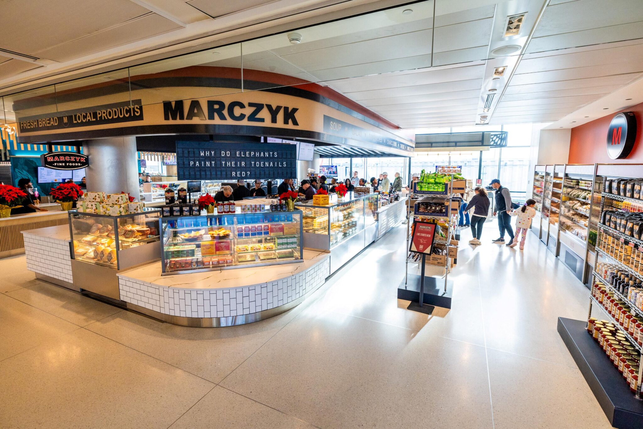 At DEN Airport: Flip board at Marczyk Fine Foods - Stuck at the Airport