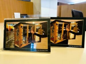 Spotted: Little free airport library has little free postcard